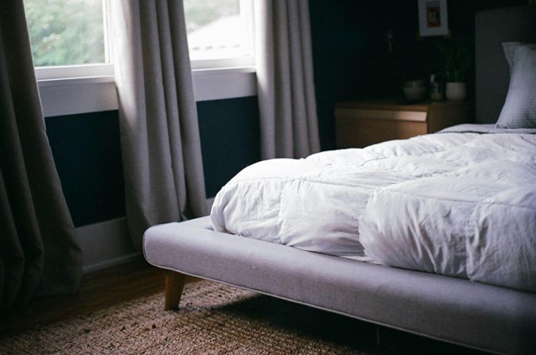 bed with mattress in a room