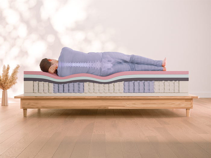 person sleeping on their side on memory foam mattress
